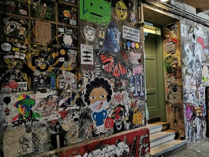 Creative and colorful wall full of graffiti and street art in an urban environment, Berlin