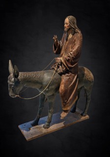 Palm tree donkey, wooden figure from around 1520, on a dark background, Diocesan Museum,