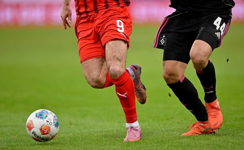Close-up football legs Luka Vuskovic Hamburger SV HSV (44) in a duel, action against Stefan