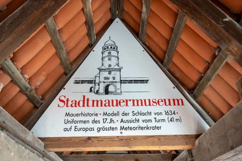 Information sign in the historic rampart for the city wall museum in the Löpsinger Turm, Donau-Ries