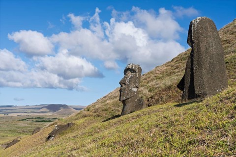 Moai stone figures on the slope of the Rano Raraku volcano, Rapa Nui National Park, Easter Island,