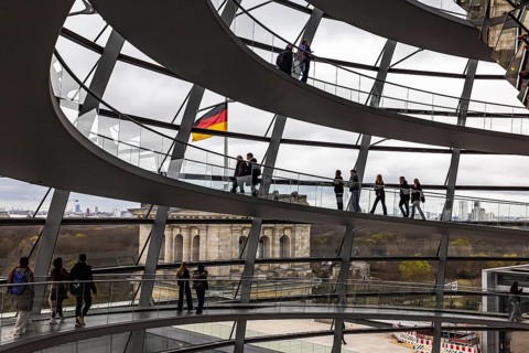 Reichstag building Berlin. Seat of the German Bundestag. Visitors in the dome on the roof of the