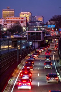 Motorway A40, Ruhr expressway, heavy traffic jam, rush hour, city passage in Essen, skyline of the