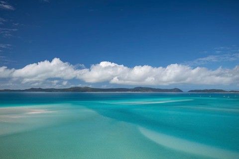 Sunny daytime view from Hill Inlet lookout over Whitehaven Beach, Whitsunday Island, Queensland,