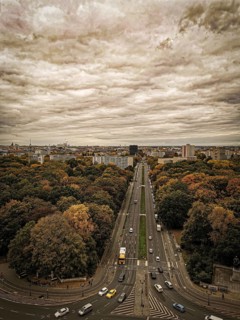 A sepia view of Berliner Straße in autumn with dramatic sky conveying a nostalgic atmosphere, view