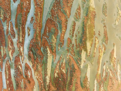 Abstract patterns at low tide in the marshland of the Walvis Bay lagoon. Aerial view. Drone shot.