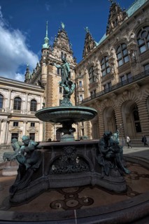 Hygieia fountain in the courtyard of Hamburg City Hall under a blue sky, Hamburg, Germany