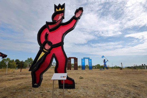 Memorial and monument with sculpture of German Unity, red glass figure with sword and crown, king,