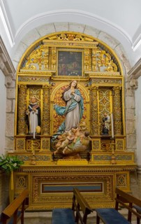 Small altar with Madonna statue and golden decorations in a church, Igreja Matriz de Esposende,