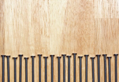Macro of Nails on a Wood Background