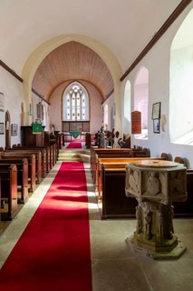 Interior view of nave to east window and altar, Holy Trinity church, Middleton, Suffolk, England,