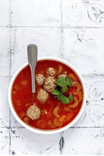 Romanian soup with meatballs, vegetable soup with meatballs, tiled table, homemade, no people