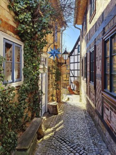 Narrow, romantic passageway with half-timbered houses on the Schlossberg, Old Town of the World