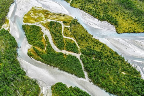 The widely branching arms of river Jostedalsola, Jostedal river, a glacial river originating in the