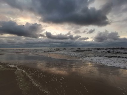 Tranquil seascape under a cloudy evening sky