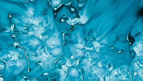 This image features an abstract, fluid art texture in shades of blue, rendered in 3D for a visually