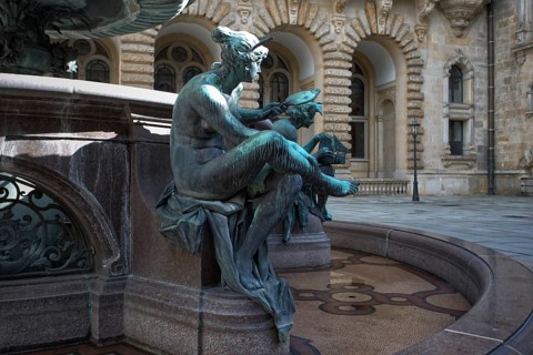 Partial view of the Hygieia fountain with an artistic sculpture in the courtyard of Hamburg City