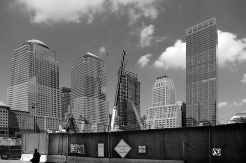 Construction fence with skyscrapers at Ground Zero, black and white, New York City, USA