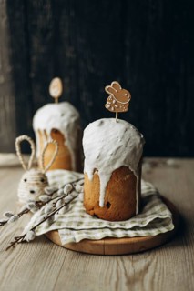 Traditional Russian Easter kulich breads, generously frosted with white icing and adorned with