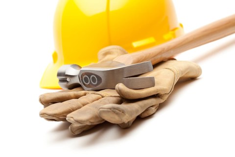 Yellow Hard Hat, Gloves and Hammer Isolated on White