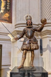 Decorative knight statue with crown and sword in a church, Seville