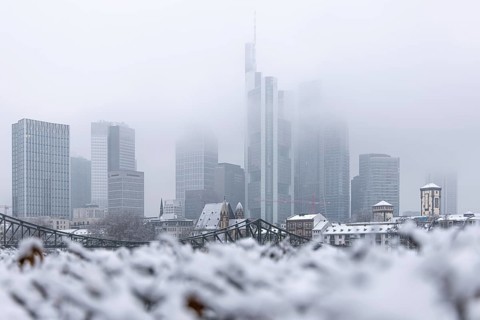 Clouds envelop Frankfurt's banking skyline. Heavy snowfalls have caused another onset of winter in