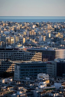 View over houses of Athens in the evening light, Athens, Attica, Greece