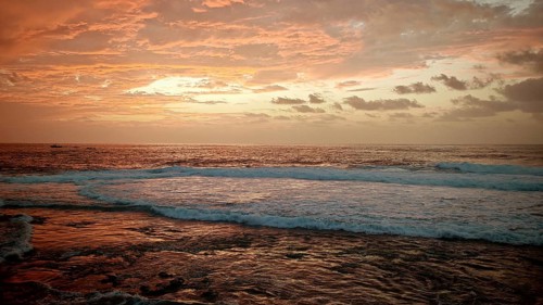 A colorful sunset over the sea with waves and clouds, Ponta do Sol, Santo Antao, Cabo Verde, Cape