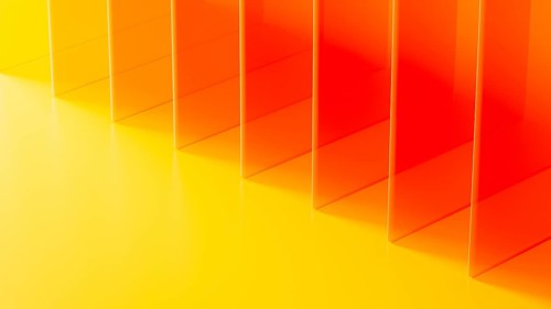 Striking formation of transparent crystals creates an abstract visual in bright warm hues,