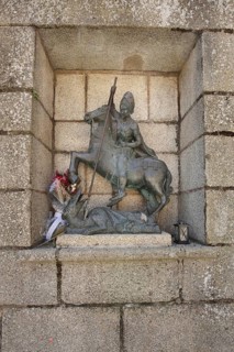 Saint George with a lance fighting dragons, bronze sculpture, Plaza de San Jorge, UNESCO old town,