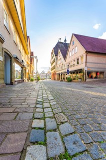 Historic alley with cobblestones and traditional buildings under a clear sky, Weil der Stadt,