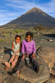 Smiling children in front of vulcano on Fogo. Cabo Verde. Africa