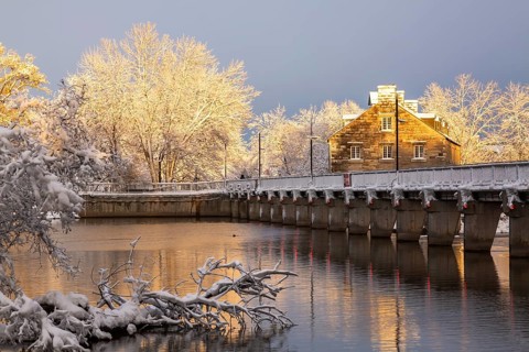 Moulin Neuf water flow control dam and walkway over Des Mille-Iles river plus New Mill on Ile des