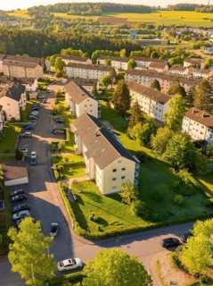 Housing estate with apartment blocks, gardens and parked cars nearby, Calw, Black Forest, Germany