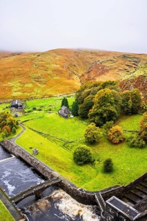 Autumn colors over Claerwen Dam, Claerwen Valley, Elan Valley Reservoir, Rhayader, Powys, Wales, UK