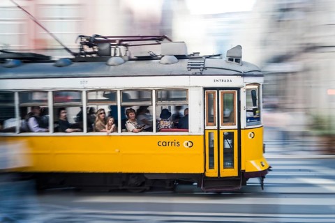 LISBON, PORTUGAL - MAY 20, 2025: Famous tram at the street of the city. Photo taken using the