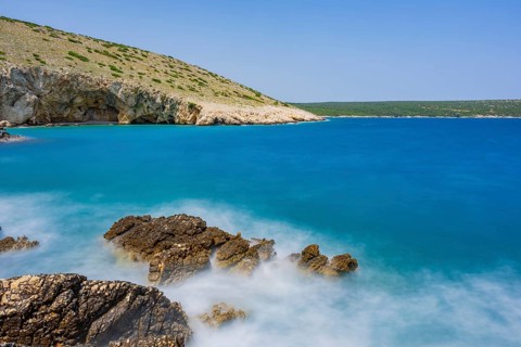 Romantic view over the sea in Koromacna Bay on a sunny day with rough seas on the island of Cres,