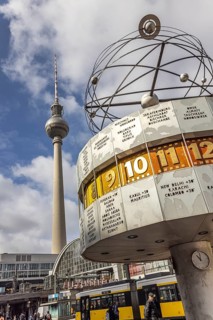 View of Alexanderplatz in Berlin. Landmark world clock and a tram. TV tower. Berlin, Germany