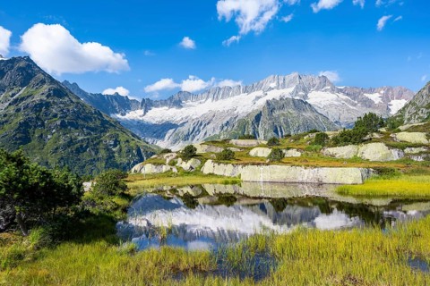 Picturesque mountain landscape, dammastock and damma glaciers reflected in Moorsee, Göscheneralp,