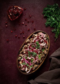 Kuchmachi, Traditional Georgian cuisine, chicken giblets appetizer, with spices and pomegranate
