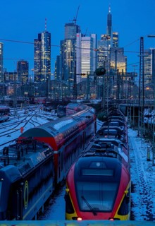 Railway tracks in front of the main railway station in Frankfurt am Main, skyline of skyscrapers in
