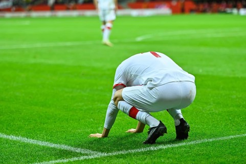 Footballer after missing shoot during soccer match in Warsaw, Poland