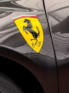 Logo of sports car brand super sports car Ferrari with jumping horse Cavallino Rampante,