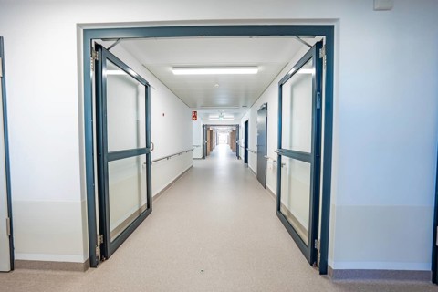 An open hospital corridor with modern glass doors and bright lighting, new Calw hospital, Germany