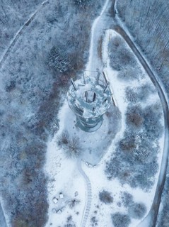 Bird's eye view of the tower, surrounded by snow and forests, cold winter ambience, Schönbuchturm,