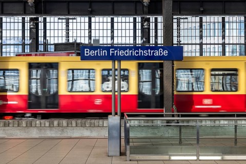 Friedrichstraße railway station in Berlin. Platform with S-Bahn and station sign. Berlin, Germany