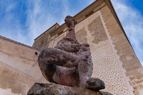 Figura Sentada de Joan Bennassar, stone figure in front of Pollenca City Hall, Majorca, Balearic