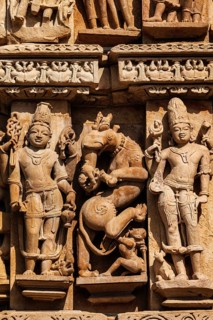 Stone carving bas relief sculptures on Adinath Temple, Khajuraho, Madhya Pradesh, India