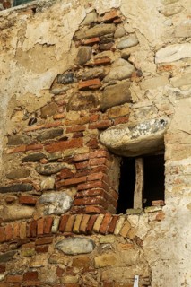 Window in abondened house in the village of Aliano, Matera District, Basilicata, Italy, Southern