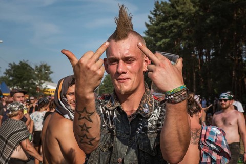 KOSTRZYN NAD ODRA, POLAND - AUGUST 2, 2018: Fan of the Pol'and'Rock Festival shows middle fingers